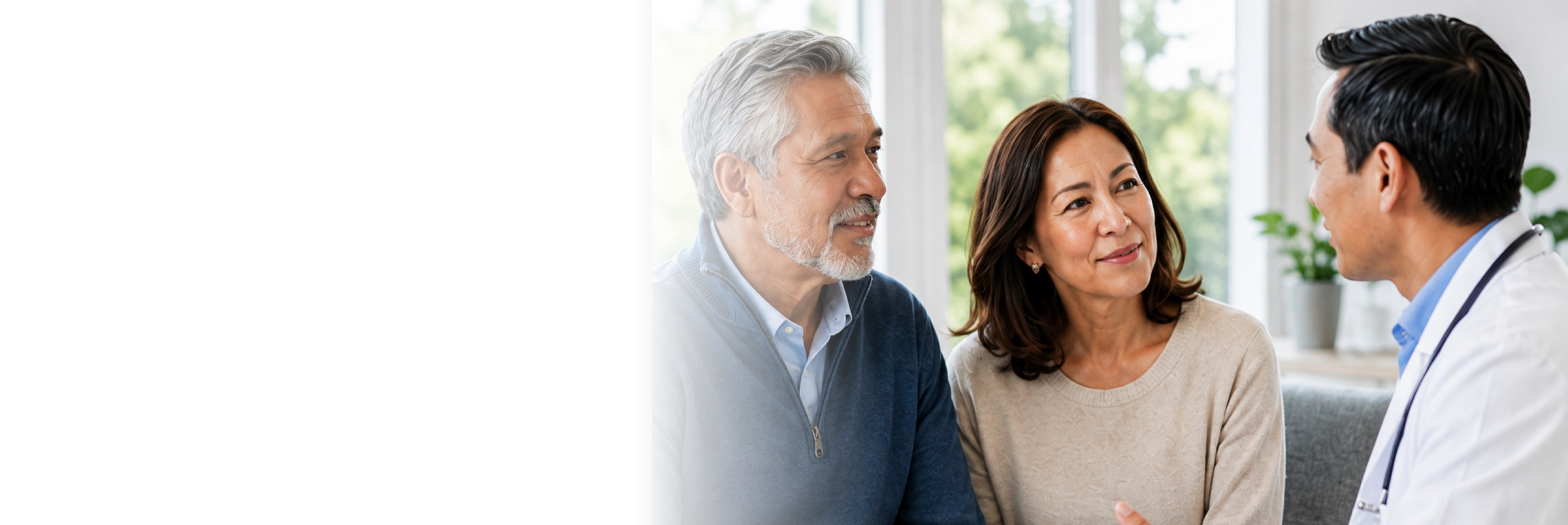 A patient and family member speaking with a physician
